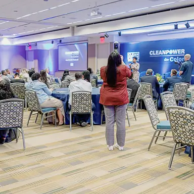 Barbara Gomez, event photographer at District Pixel, covering the CLEANPOWER conference in Arizona.