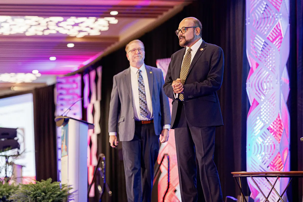 Speaker presenting on stage during a Washington DC conference with professional event photography coverage