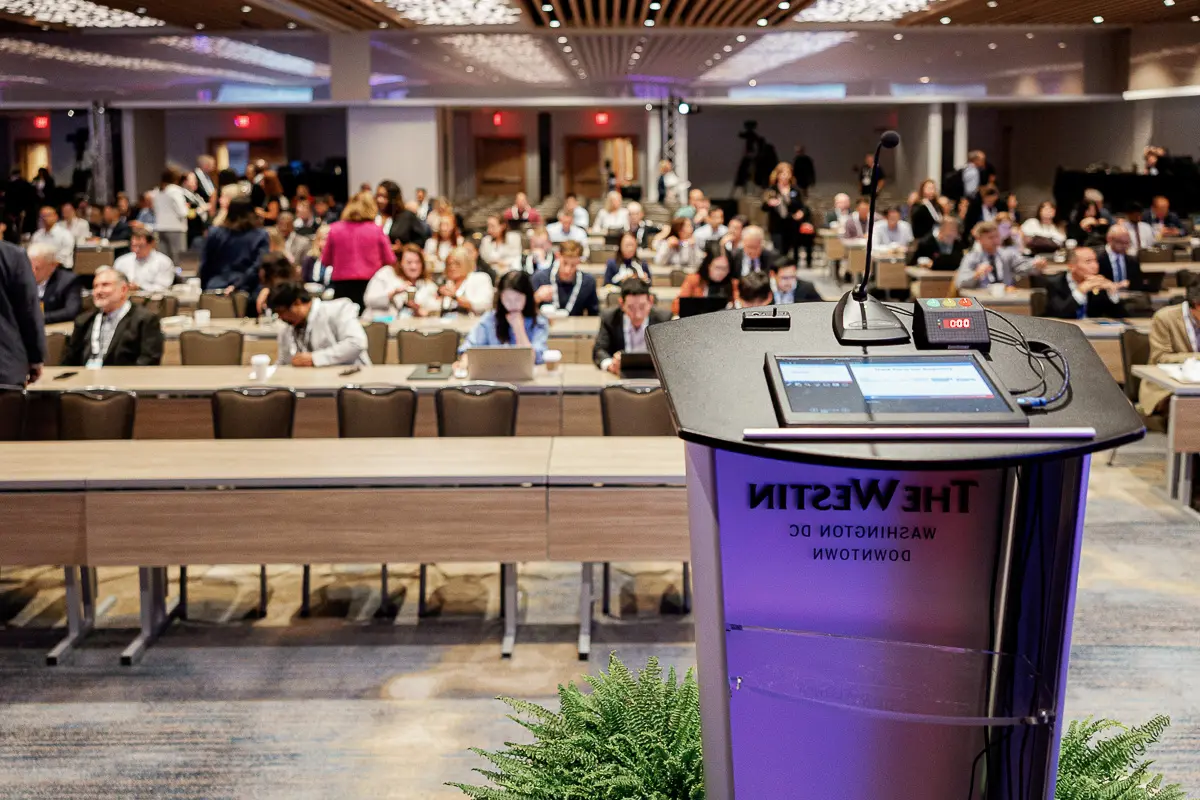 Podium and audience view at a Washington DC hotel conference prepared for speaker coverage