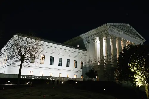 Illuminated government building exterior at night — corporate event photography Washington DC