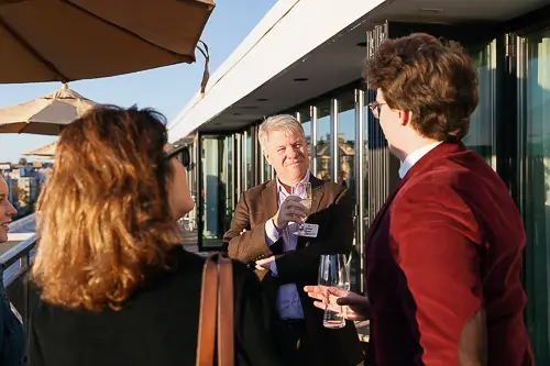 Corporate event photography Washington DC capturing professionals networking during an outdoor corporate reception