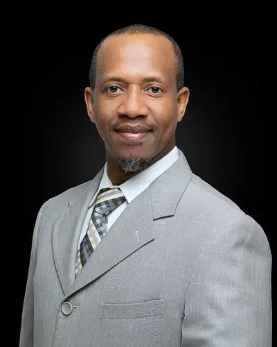 Professional corporate headshot of a man photographed by District Pixel in Washington DC on a black background
