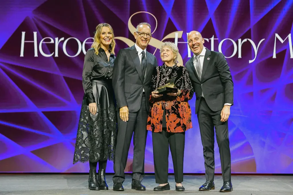 Award presentation during a nonprofit gala in Washington DC with honorees on stage and a branded backdrop