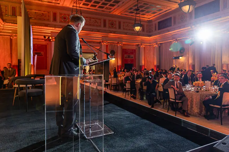 Keynote stage and seated gala dinner setup inside Union Station in Washington DC