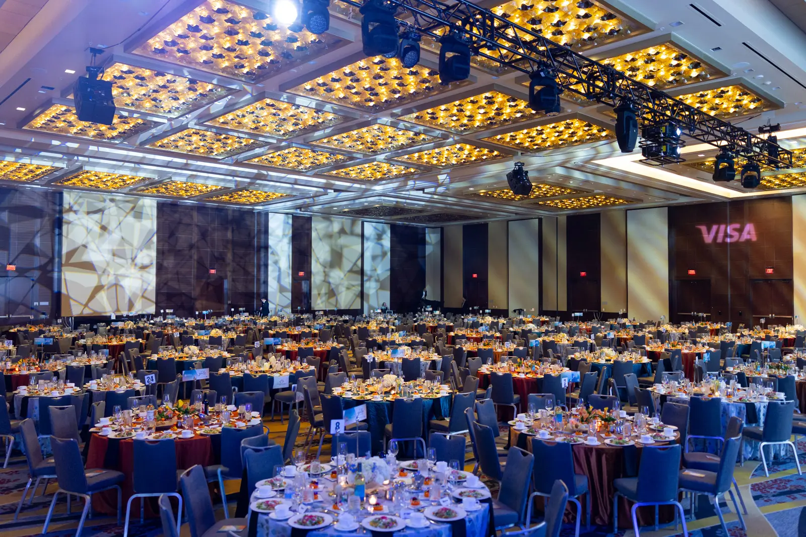 Empty Washington DC event room photographed before guests arrive with tables and staging ready