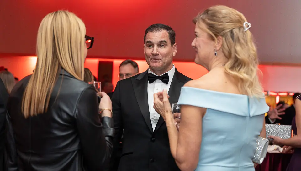 Corporate event guests networking and reacting during a Washington DC event