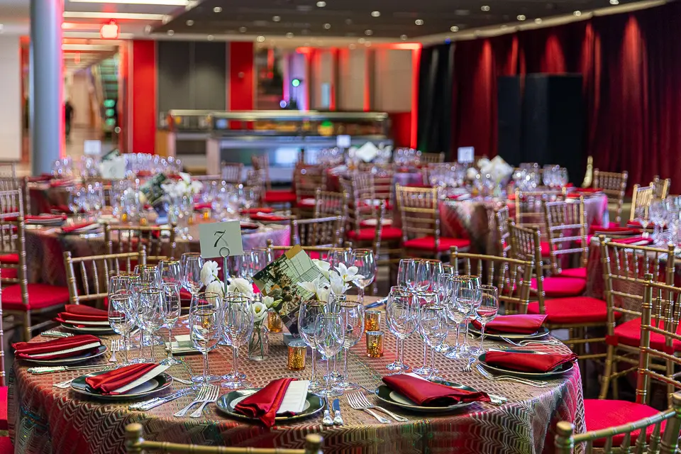 Washington DC event venue setup with signage, stage details, and room preparation photographed before guests arrive