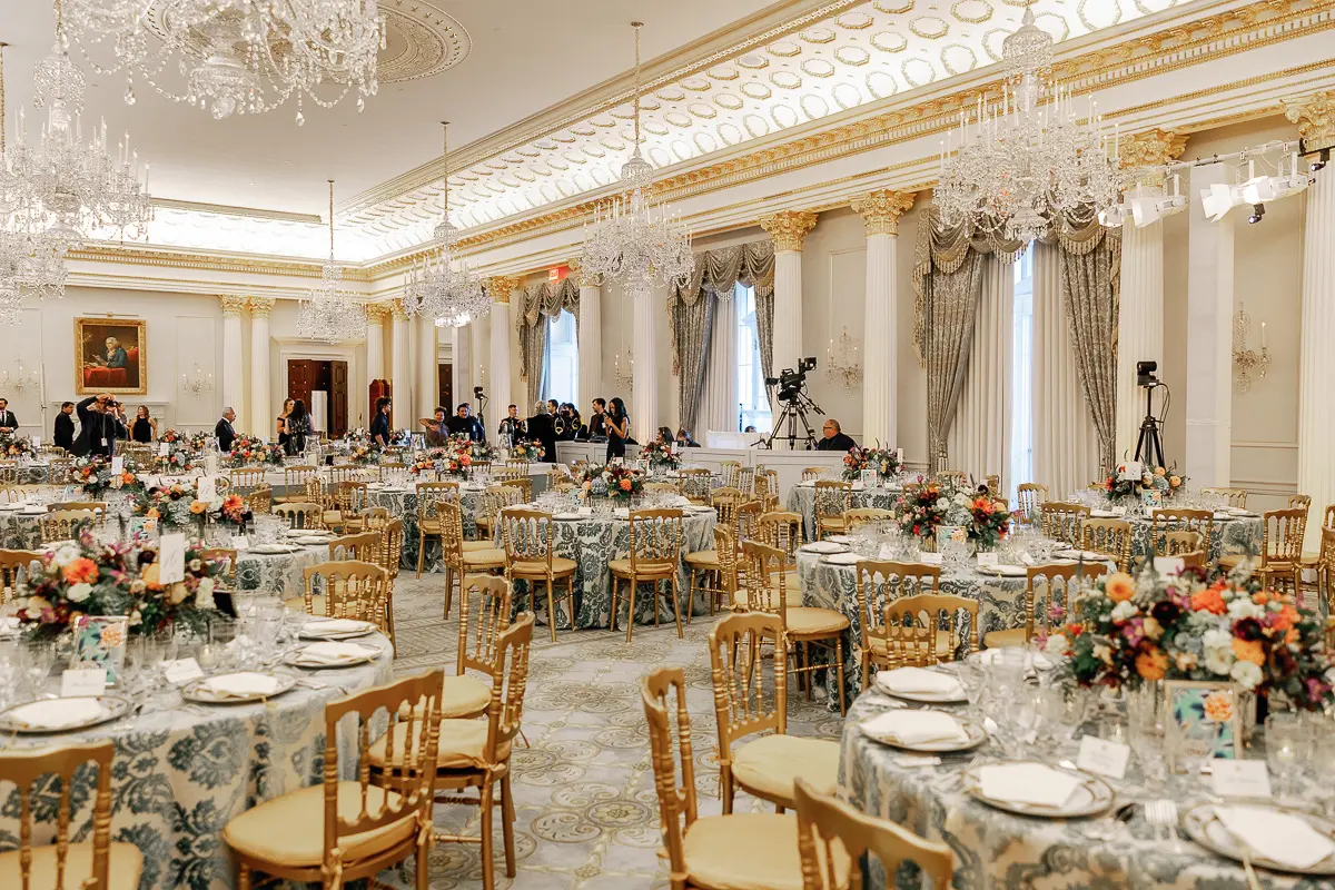 Diplomatic dinner event photographed inside the Benjamin Franklin State Dining Room at the Department of State in Washington DC