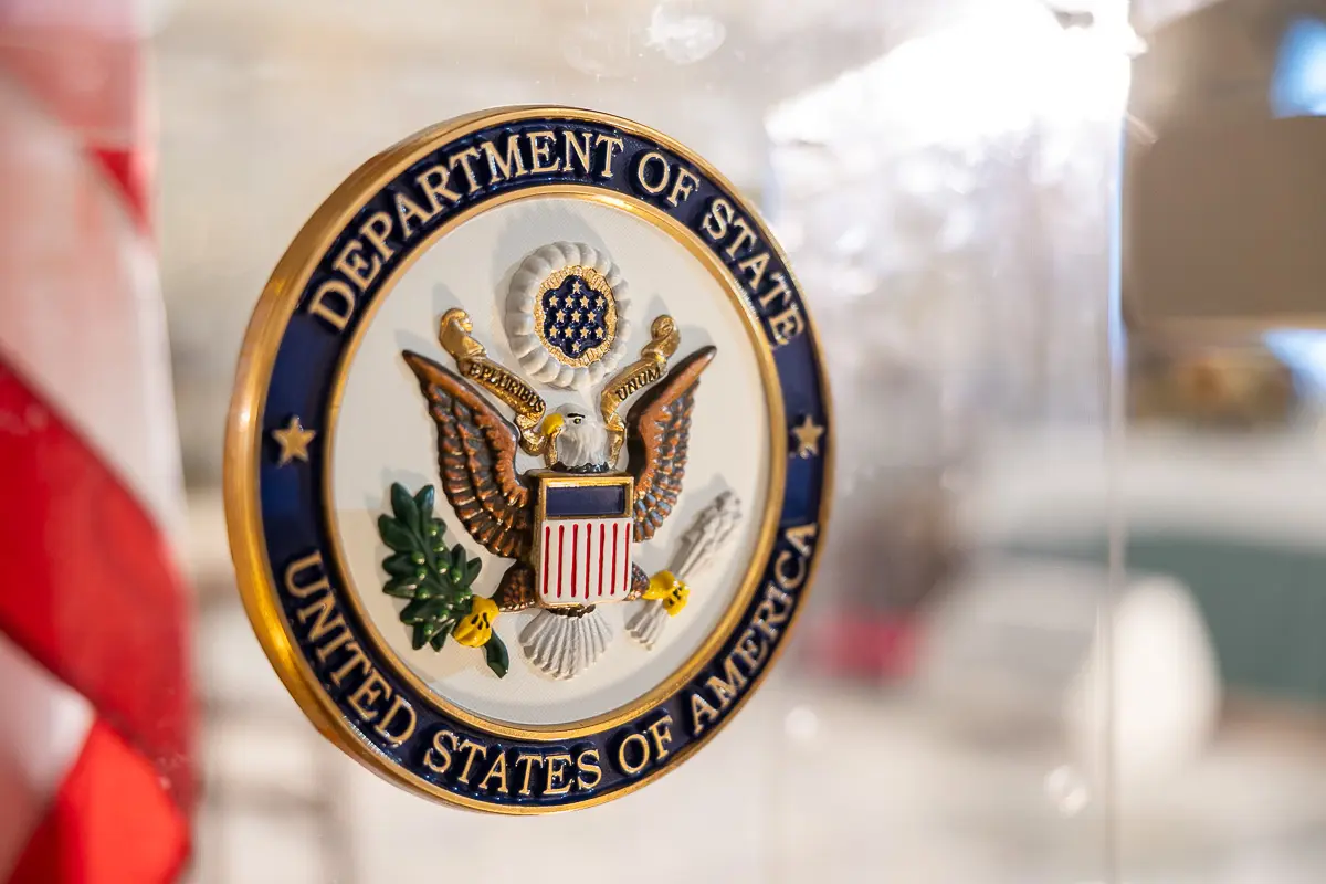 Department of State podium sign photographed at a Washington DC diplomatic event for official communications