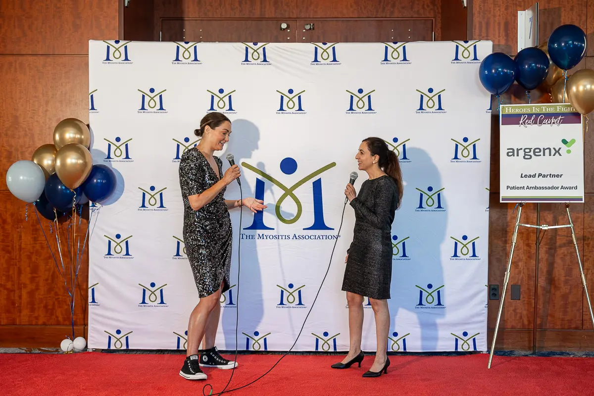 Nonprofit speakers preparing on a red carpet before a Washington DC event photographed for communications use
