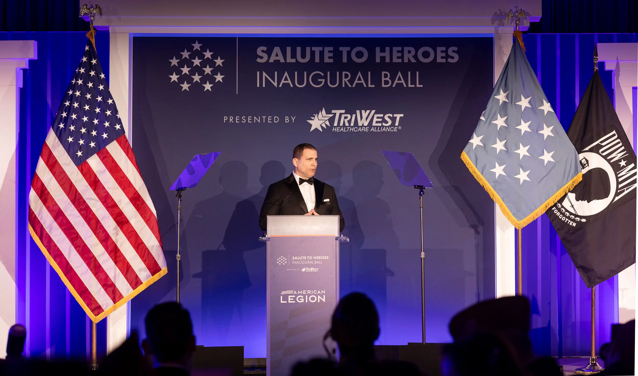 Conference speaker photographed at a Washington DC government association event for communications and editorial coverage