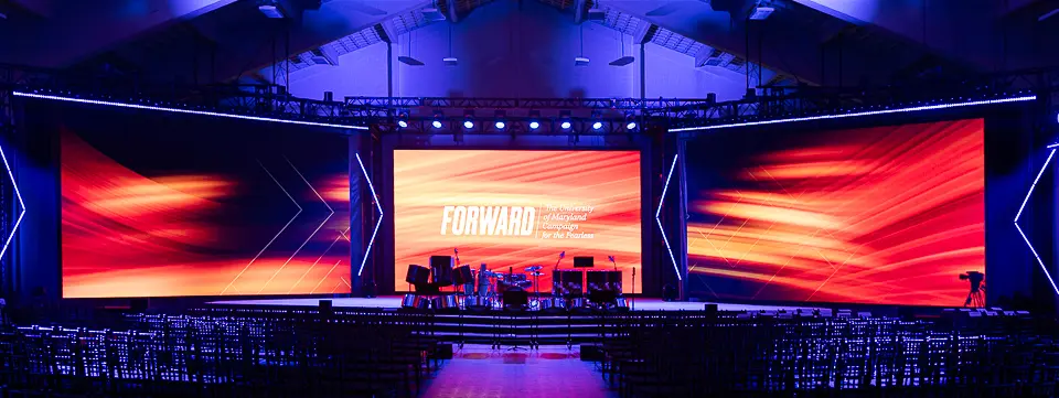 Wide Washington DC corporate event room with audience engagement showing event scale for reports and future promotion