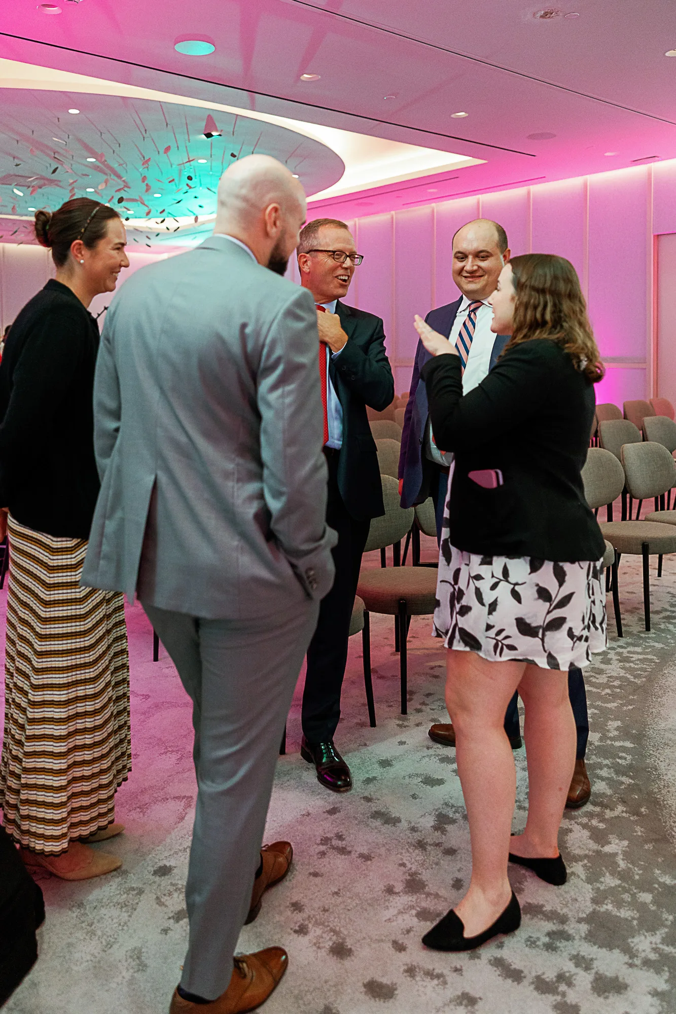 Attendees holding drinks at Punchbowl News press conference Washington DC
