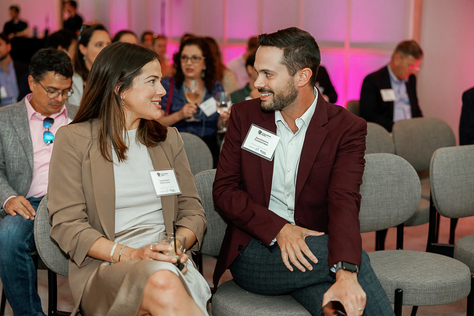 Two attendees conversing at Punchbowl News press conference Washington DC