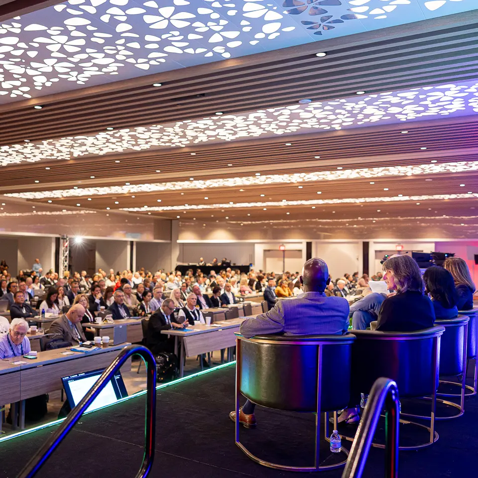 FDA-PDA Annual Conference ballroom stage with dramatic ceiling lighting and seated audience