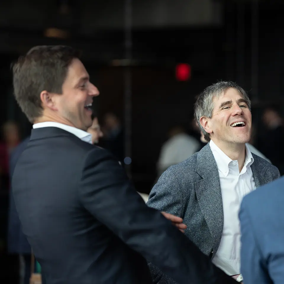 Guests laughing during the FDA-PDA Annual Conference reception at The Westin