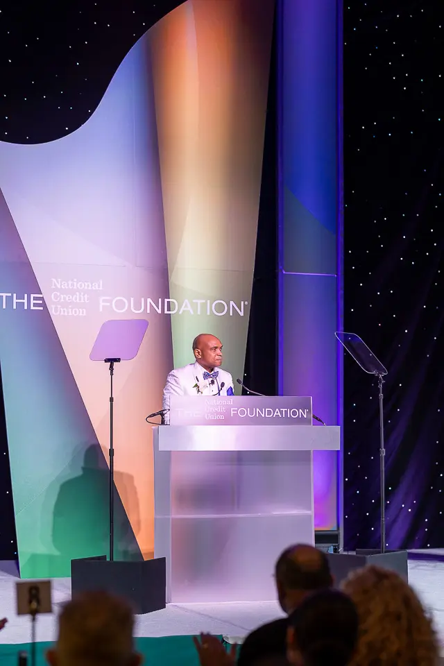 Speaker at the Herb Wegner Awards 2026 podium addressing guests from the stage.