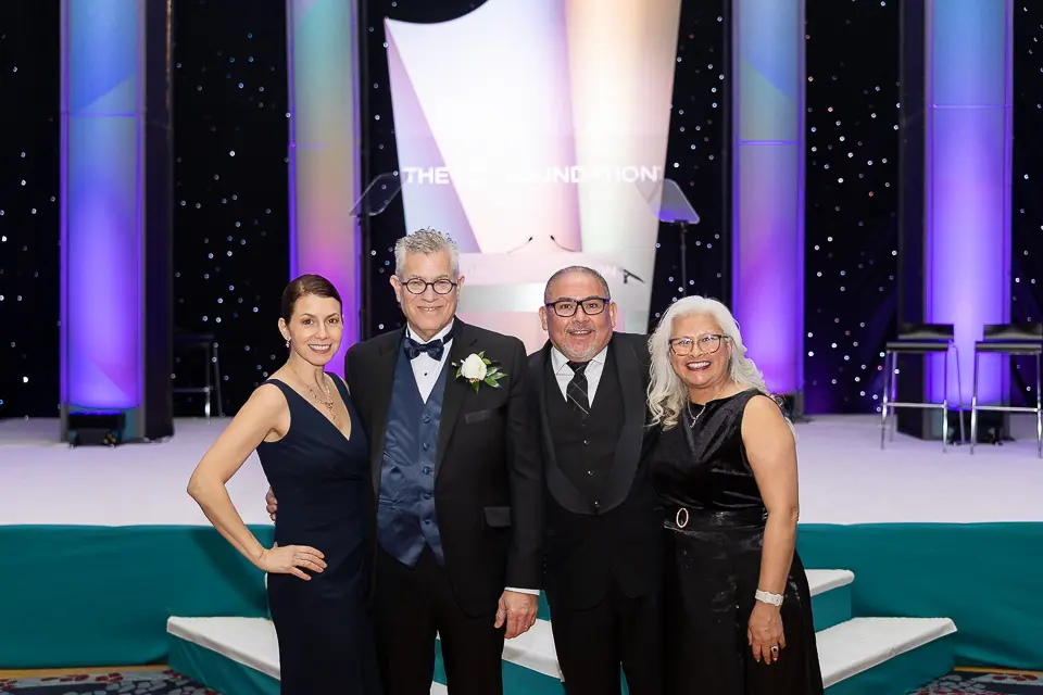 Guests posing as a group on the Herb Wegner Awards 2026 stage after the awards presentation.