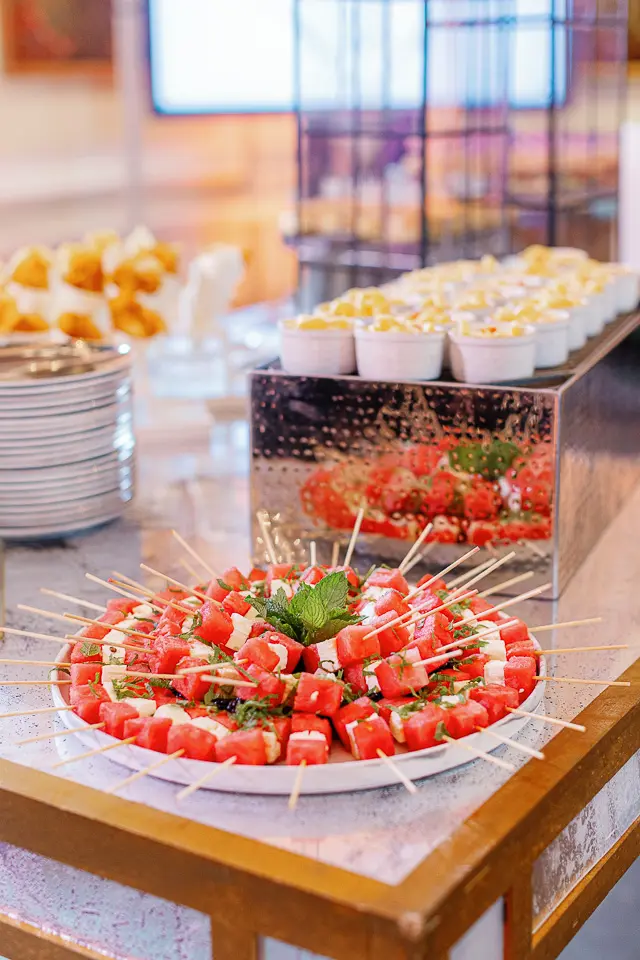 Colorful passed appetizers arranged on trays for an event reception
