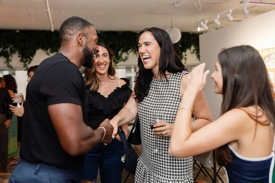 The Scout Guide Washington DC launch party guests laughing conversation
