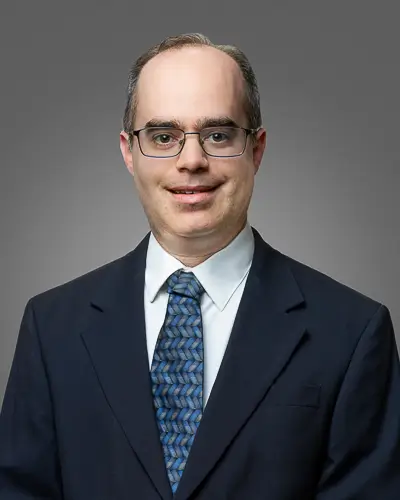 Executive business headshot on gray background photographed in Washington DC by District Pixel