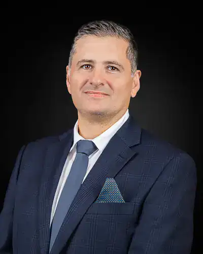 Executive business headshot of professional in navy suit photographed in Washington DC by District Pixel