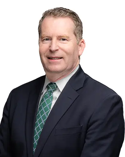 Professional business headshot of man in navy suit with green tie photographed in Washington DC by District Pixel