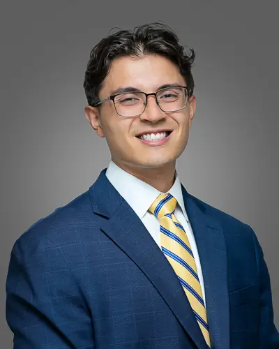Professional corporate headshot of a young man in blue suit photographed in Washington DC by District Pixel