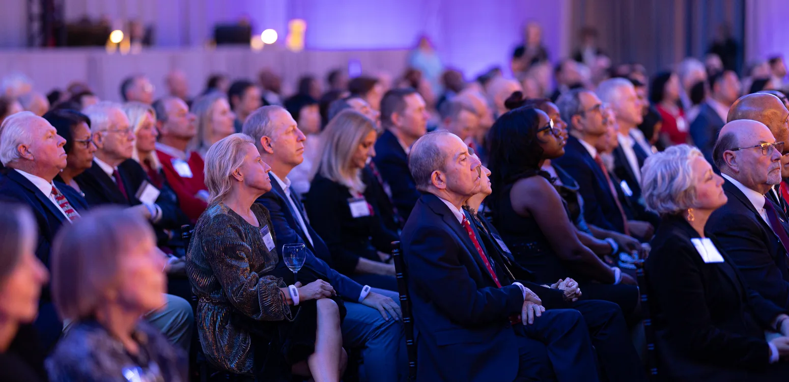 Corporate event audience watching a keynote presentation in Washington DC photographed by District Pixel.