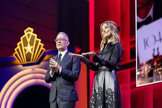 Two presenters on stage at a corporate event in Washington DC