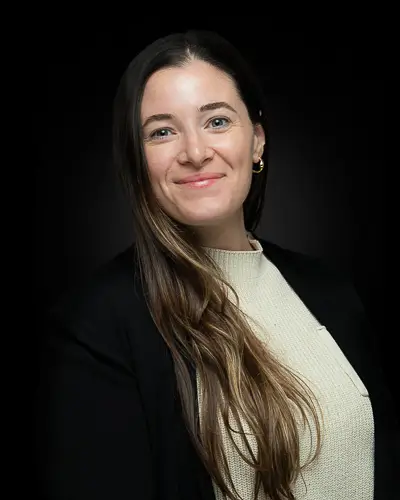 Professional corporate headshot of a woman with natural portrait lighting photographed in Washington DC by District Pixel
