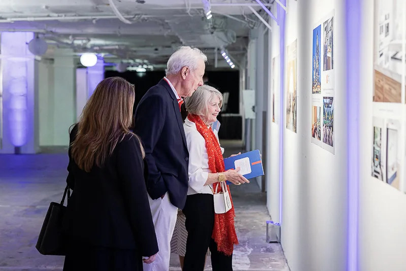 Color Washington DC event photographer coverage of guests viewing a gallery installation