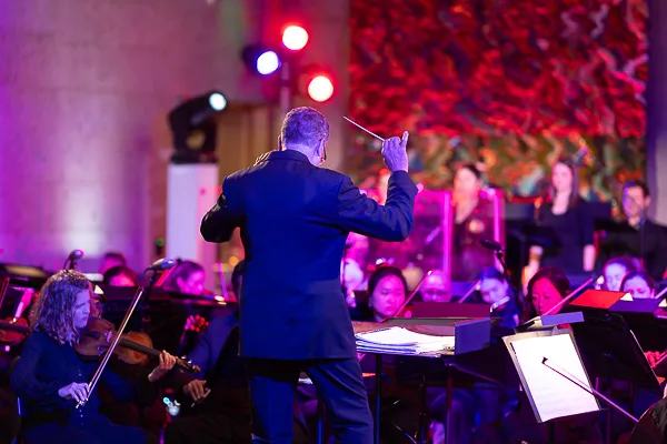 Washington DC event photographer documenting a live orchestra performance at a corporate gala